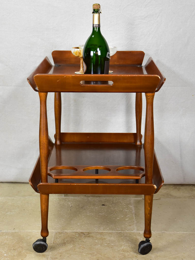 Traditional bar cart with bottle holders