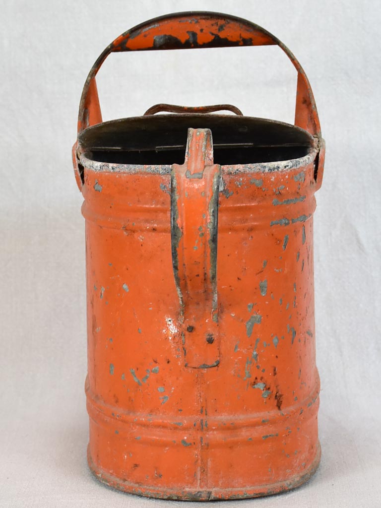 Antique French covered watering can with red patina