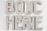 Distinctive metallic lettering from butcher shop