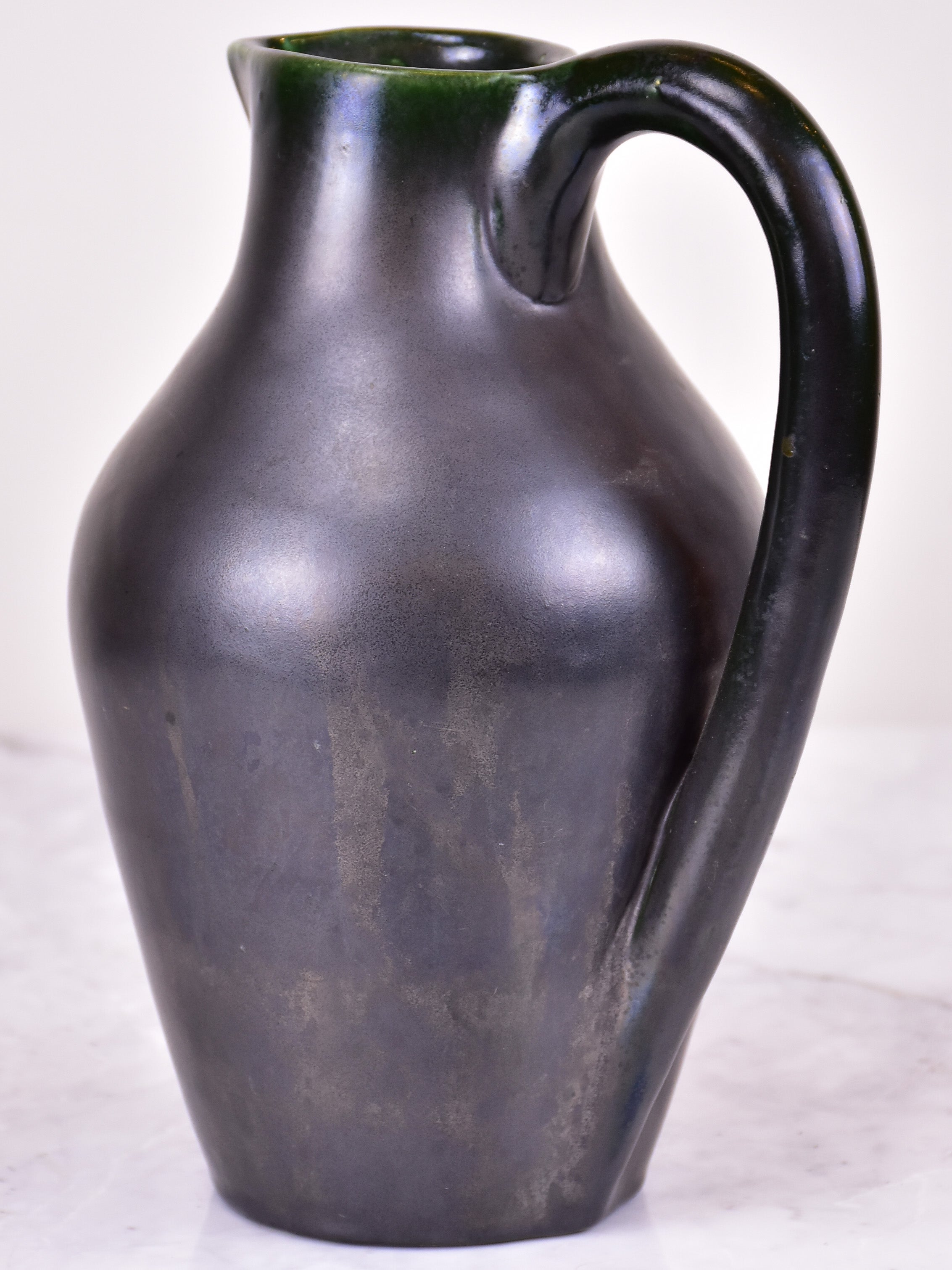 Black mid-century jug signed OUDIN