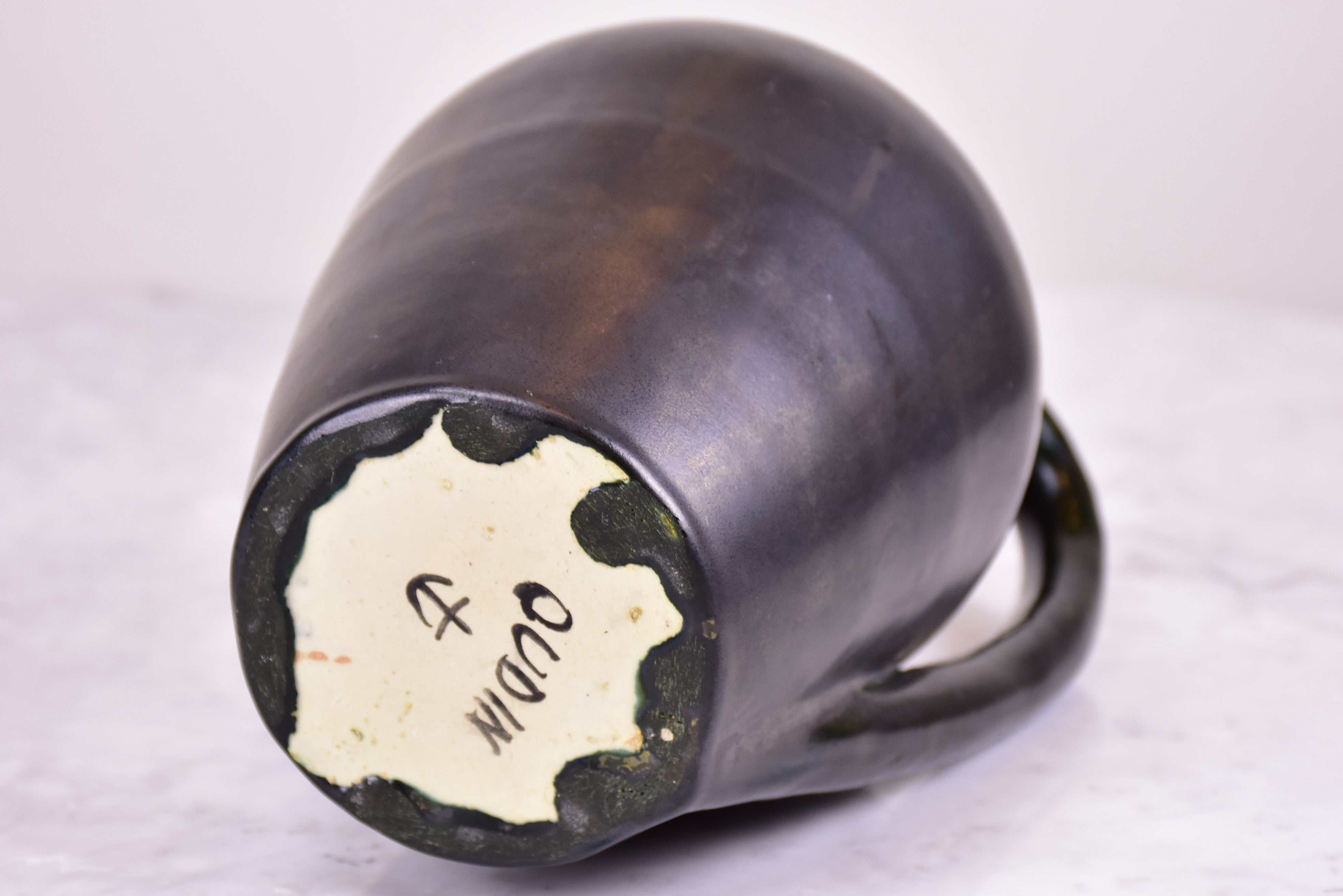 Black mid-century jug signed OUDIN