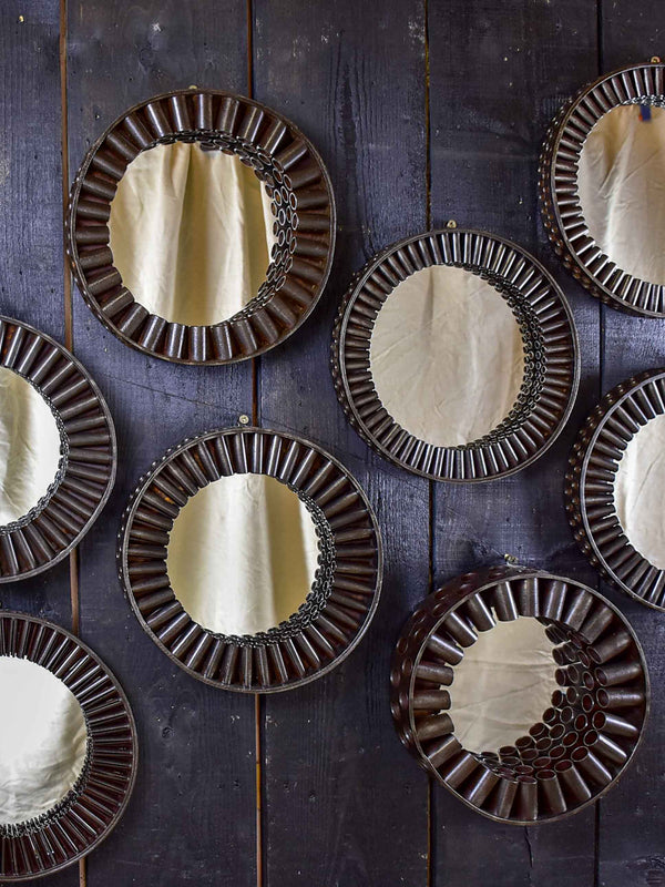 Round mirrors made from salvaged industrial materials
