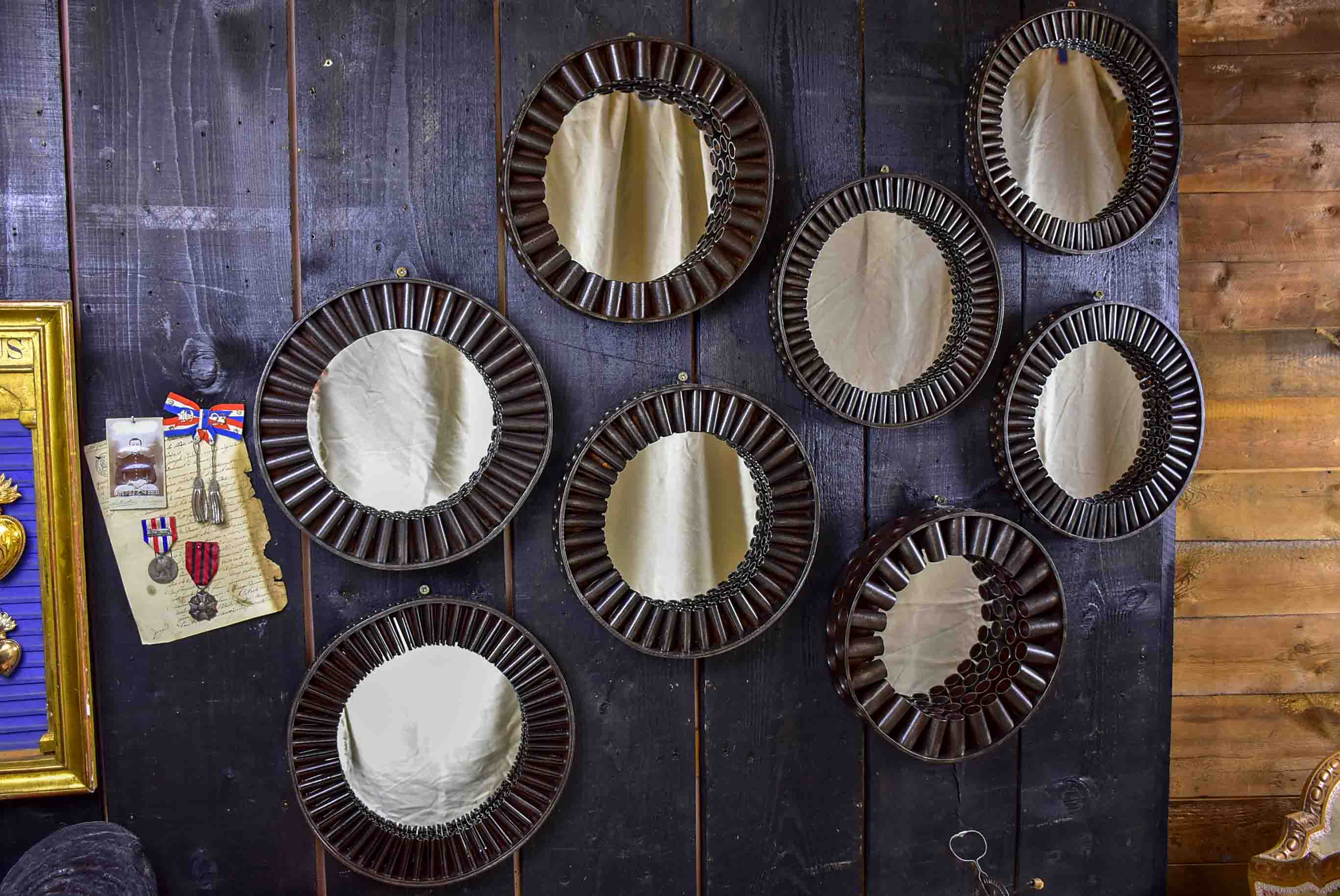 Round mirrors made from salvaged industrial materials