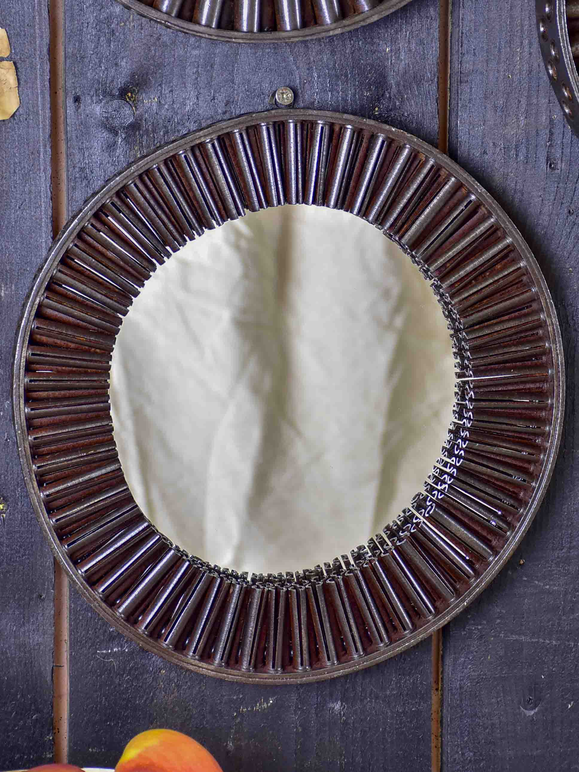 Round mirrors made from salvaged industrial materials