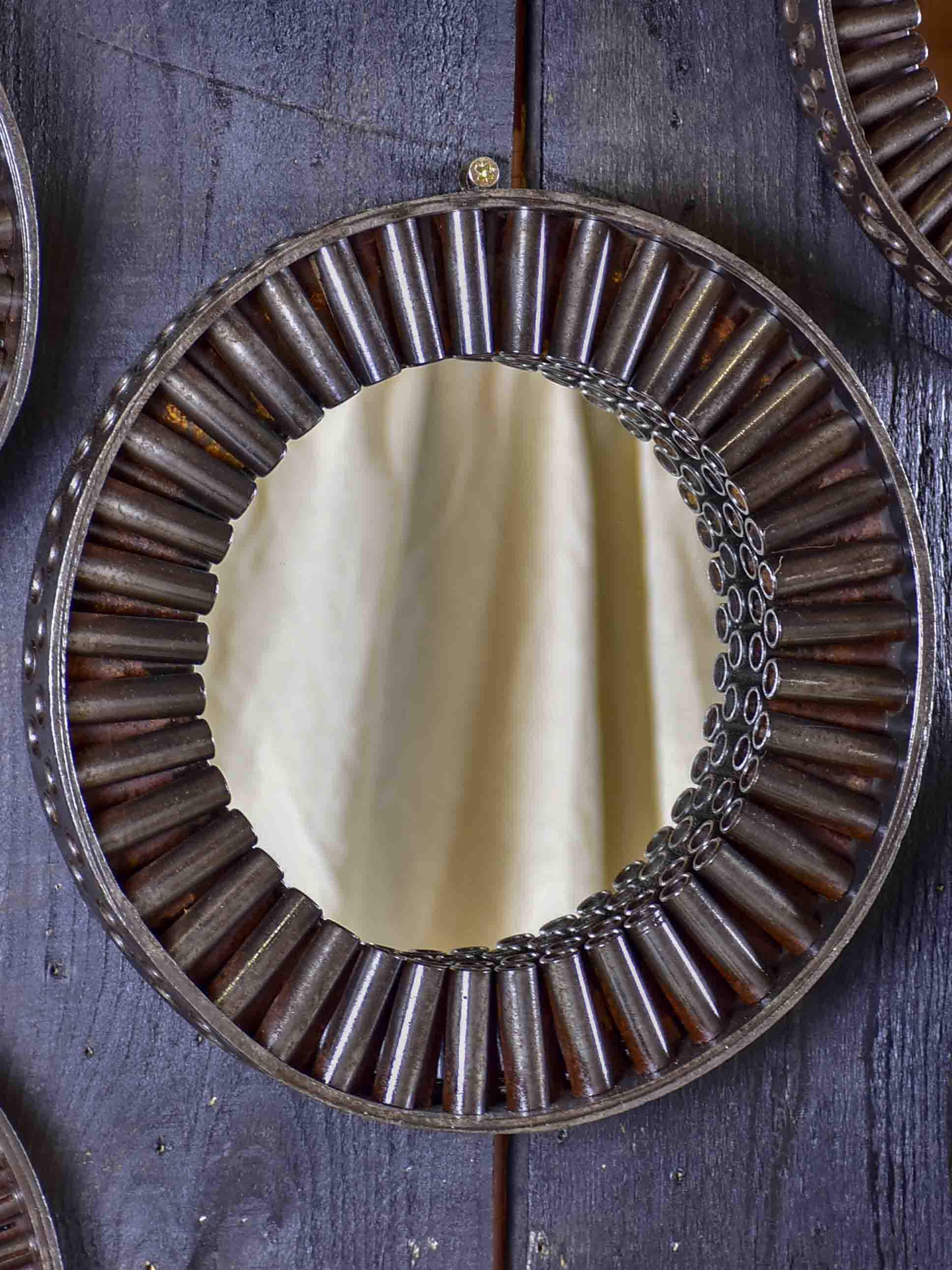Round mirrors made from salvaged industrial materials