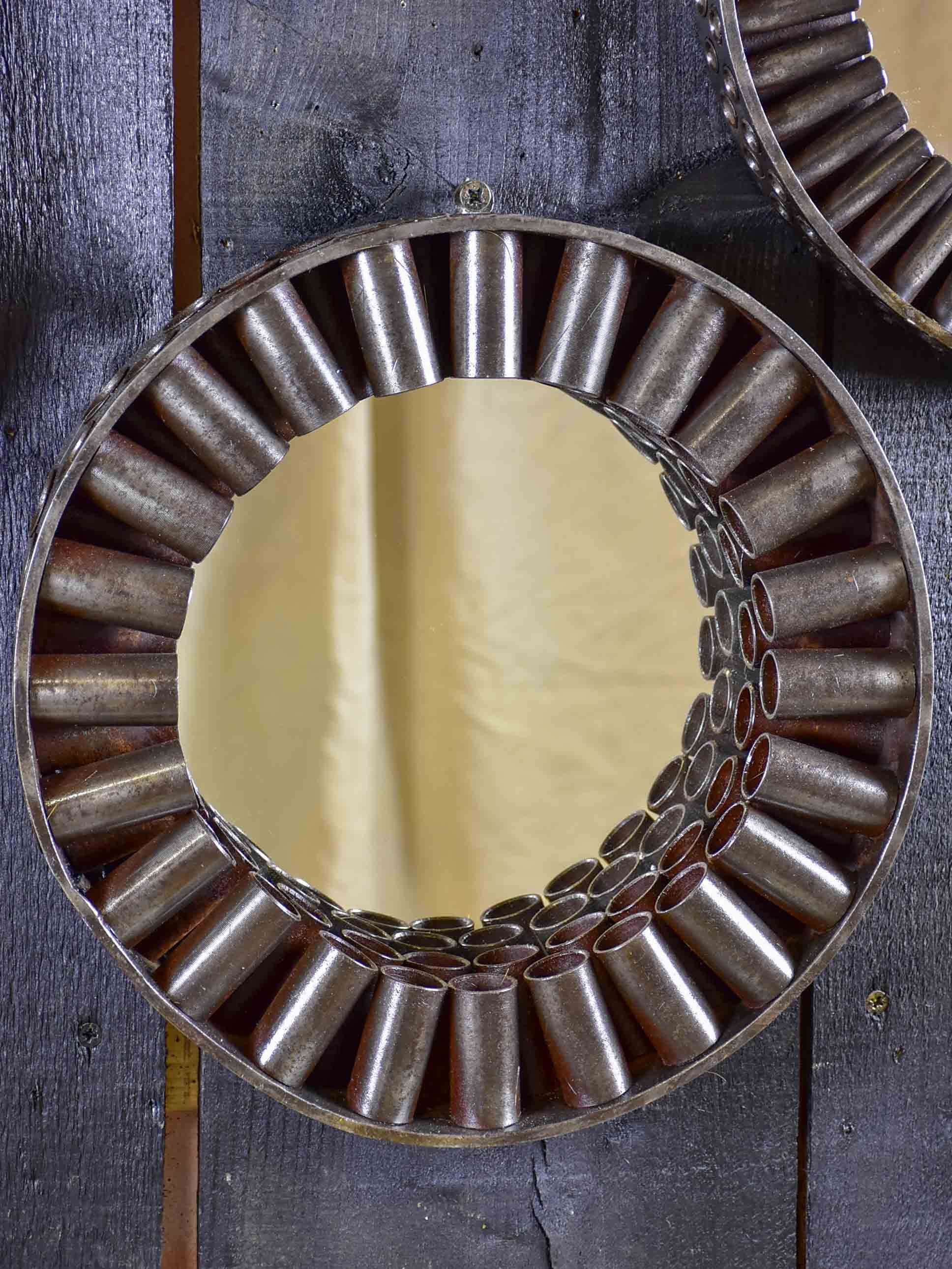 Round mirrors made from salvaged industrial materials