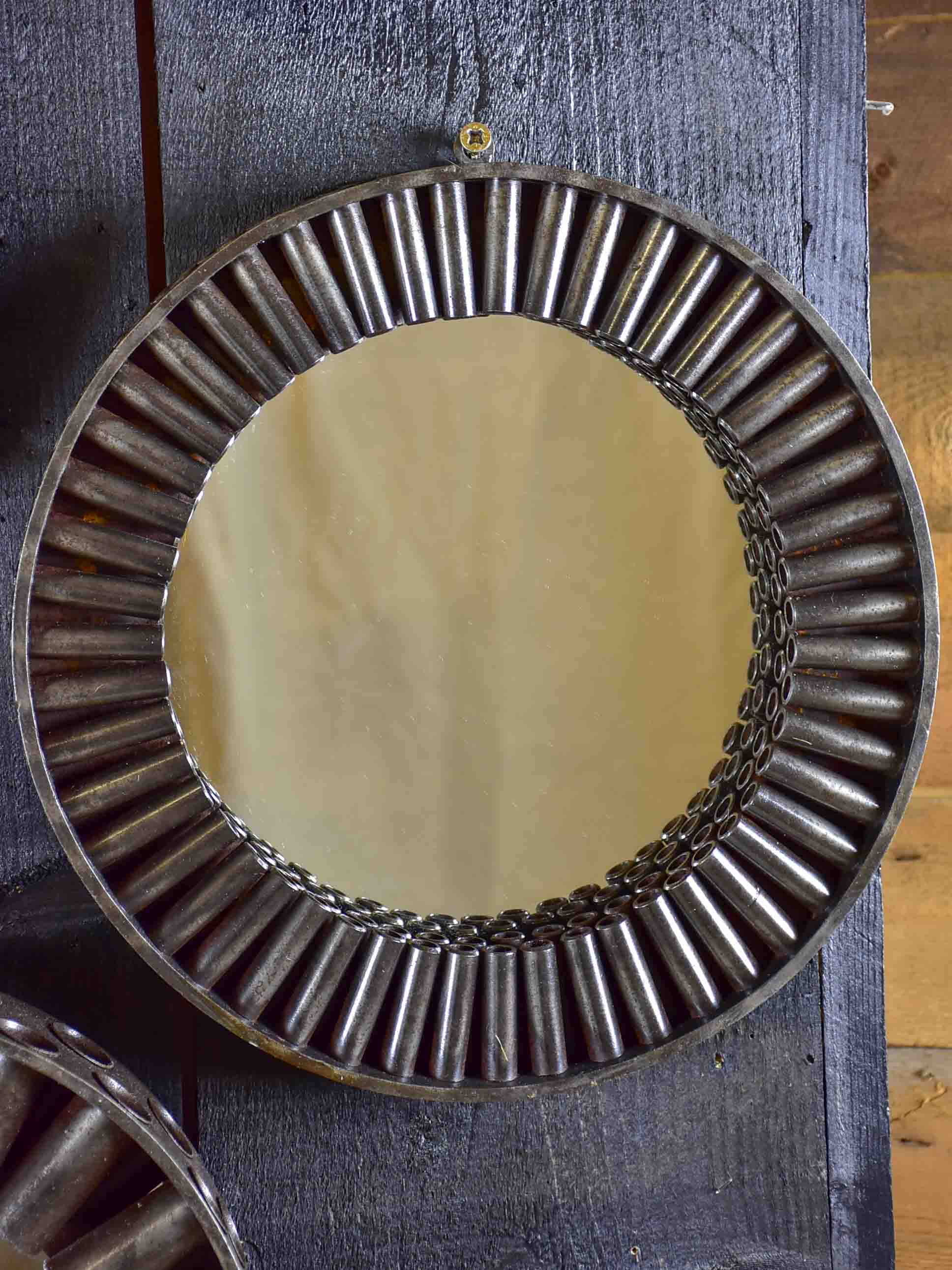 Round mirrors made from salvaged industrial materials