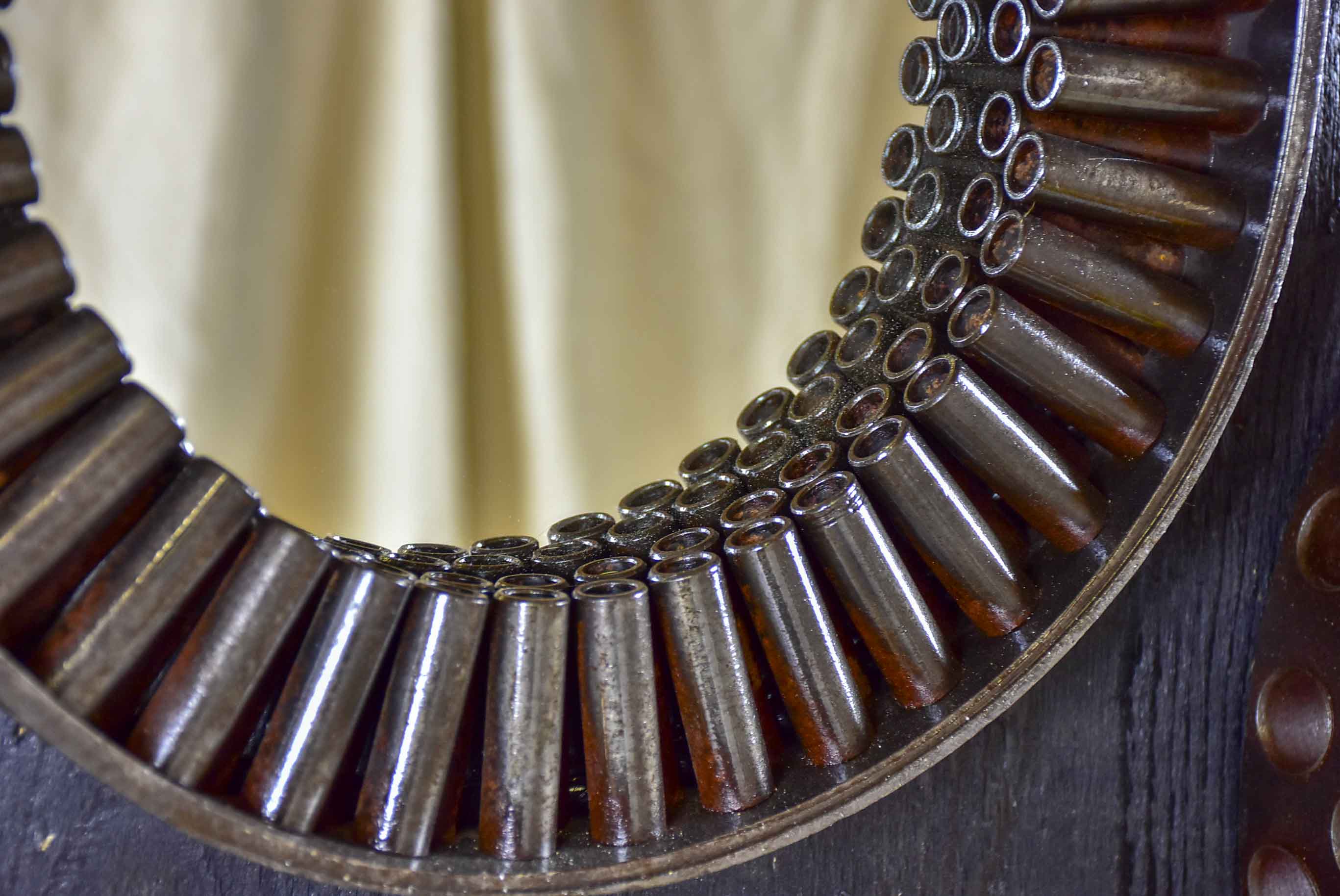 Round mirrors made from salvaged industrial materials