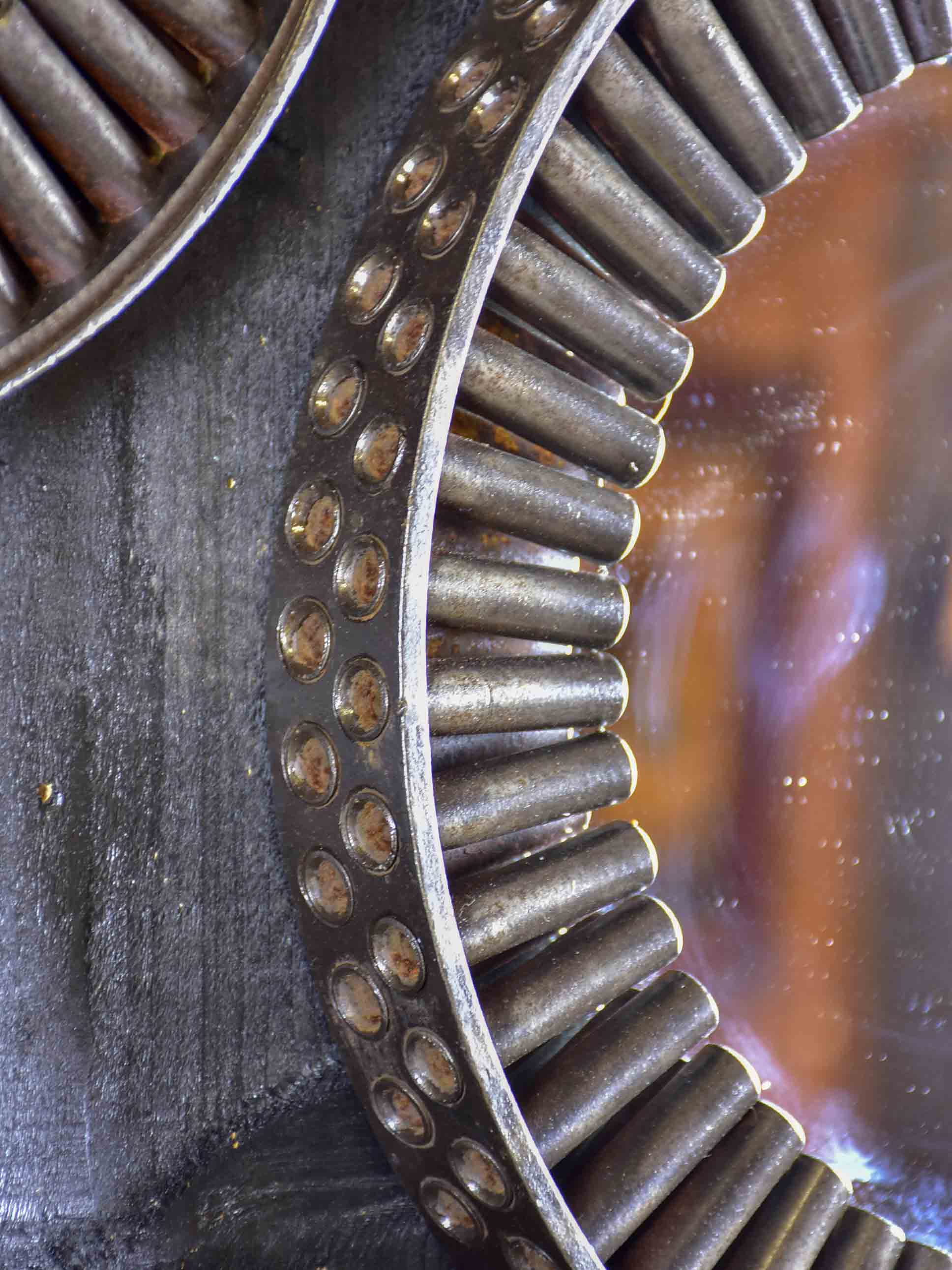 Round mirrors made from salvaged industrial materials