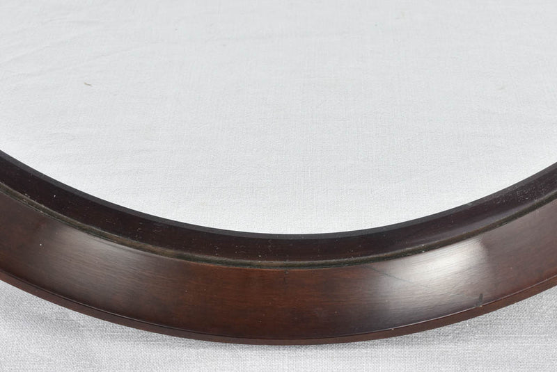 Elegant wooden-framed Italian circular mirror