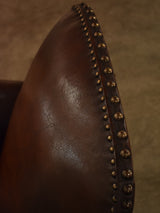 Dark French leather studded club chair - clouté