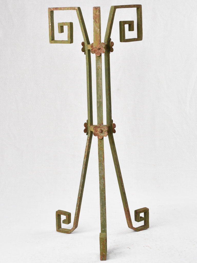 Rustic iron stand with green patina