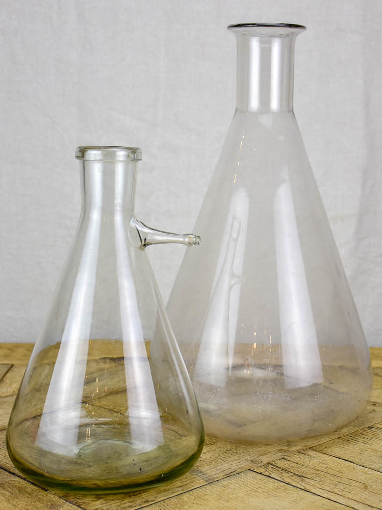 Two large vintage glass flasks from a laboratory