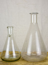 Two large vintage glass flasks from a laboratory