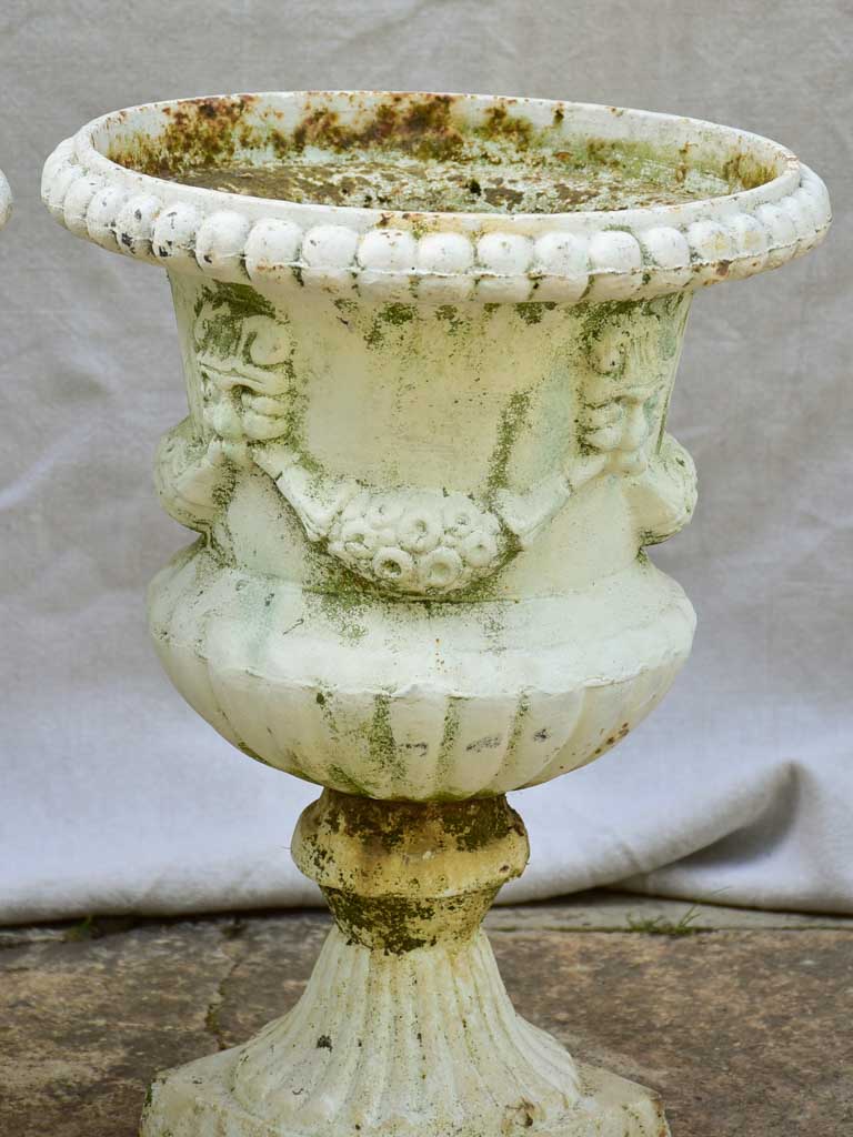 Pair of 19th Century cast iron Medici urns with white paint finish 17¼"