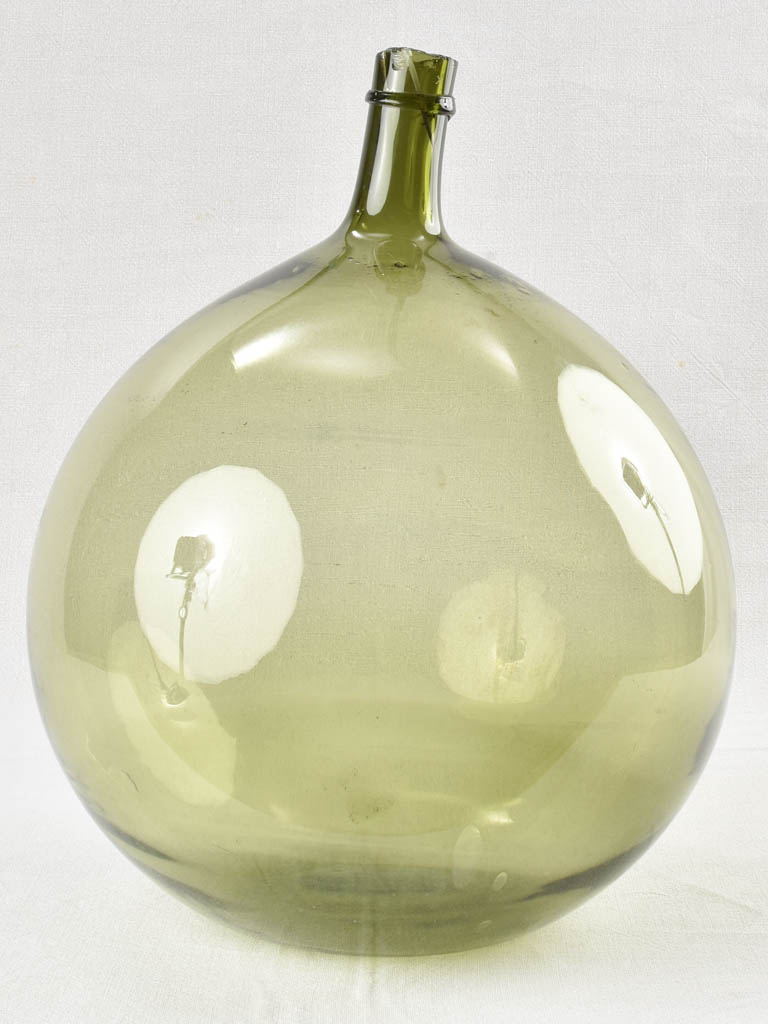 Antique demijohn blown glass bottle