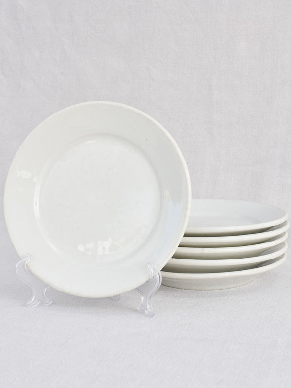 Timeworn early-20th-century white ceramic side plates