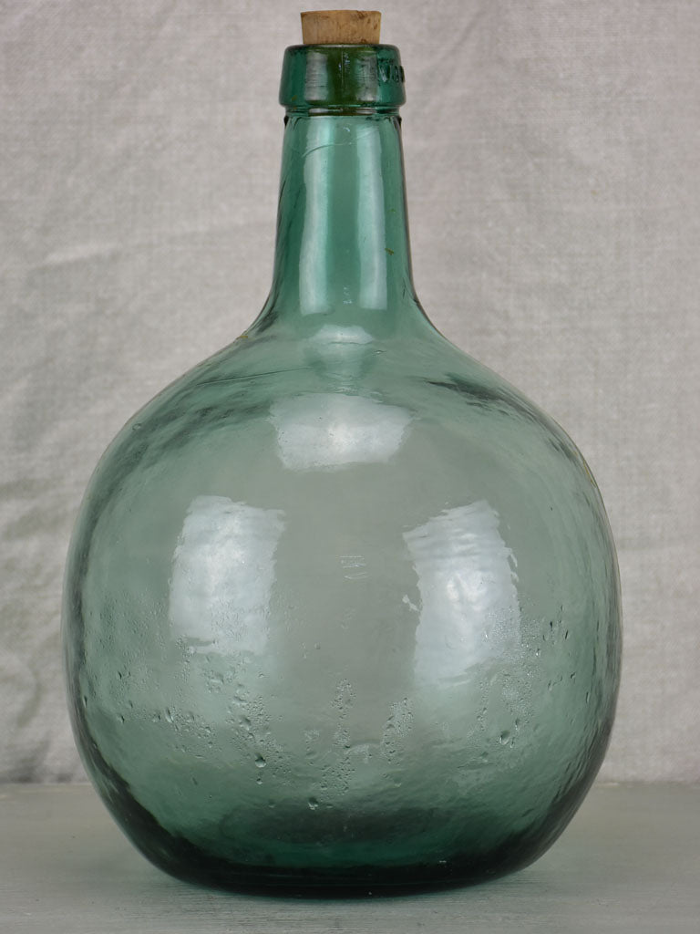Small antique French demijohn bottle