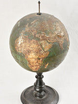 Vintage world globe with mountain terrain