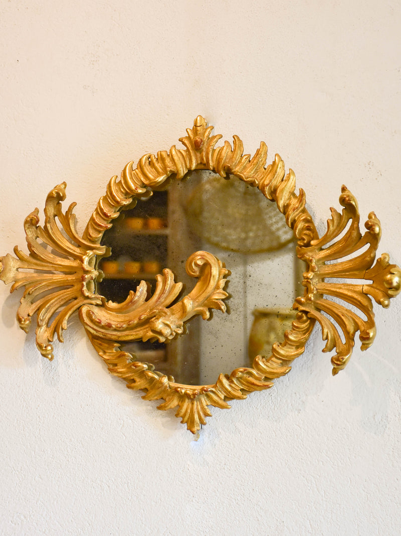 Decorative round Louis XV mirror with gilt wood frame