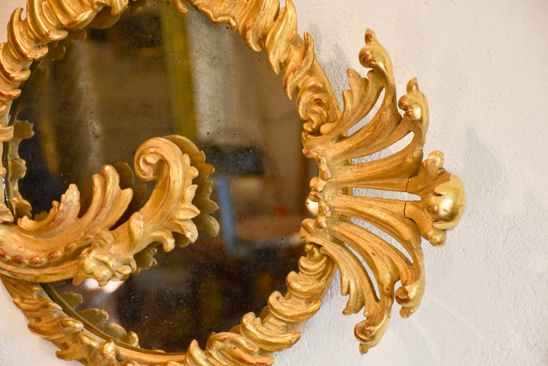 Decorative round Louis XV mirror with gilt wood frame