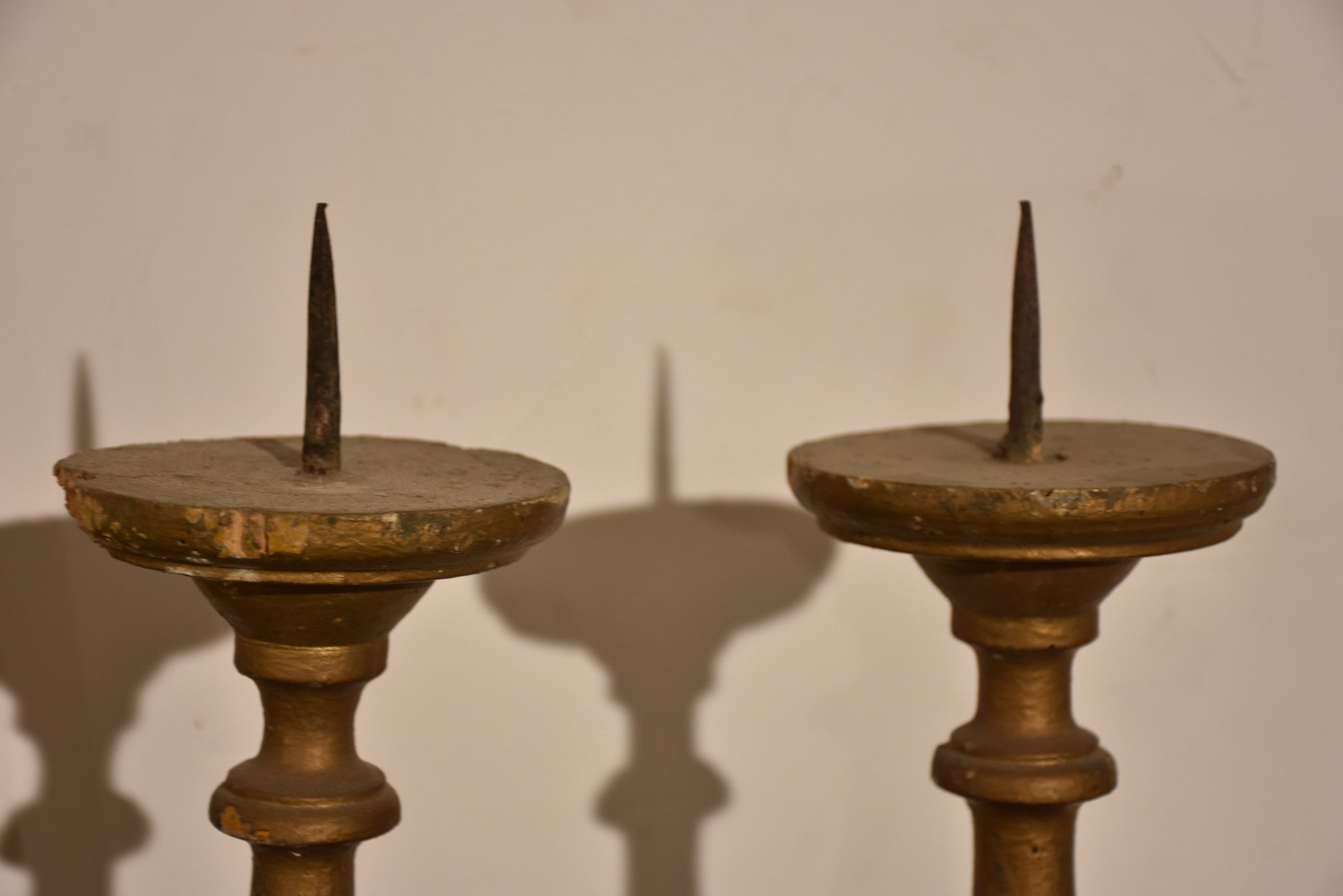 Pair of carved antique Italian candlesticks