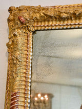 Gilded Napoleon III mirror with sculptural frame