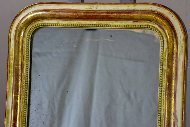 Rustic antique French Louis Philippe mirror with timeworn gilded frame