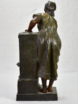 Early twentieth century metal sculpture of a lady at a fountain 30¼"