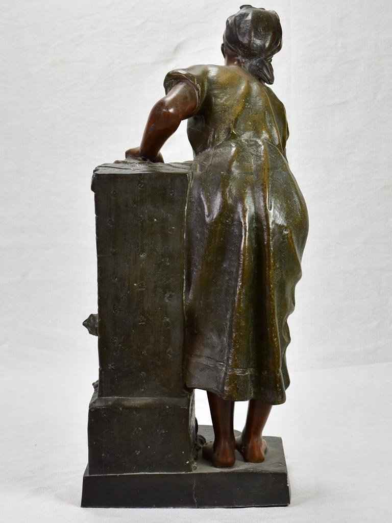 Early twentieth century metal sculpture of a lady at a fountain 30¼"