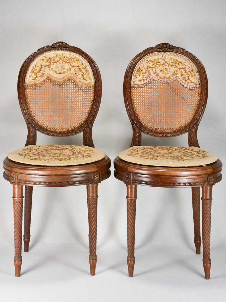 Louis XVI-style armchairs with cross-stitch upholstery