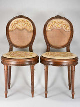 Louis XVI-style armchairs with cross-stitch upholstery