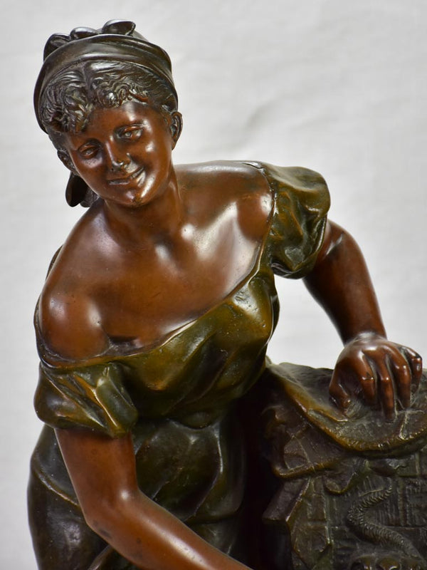 Early twentieth century metal sculpture of a lady at a fountain 30¼"
