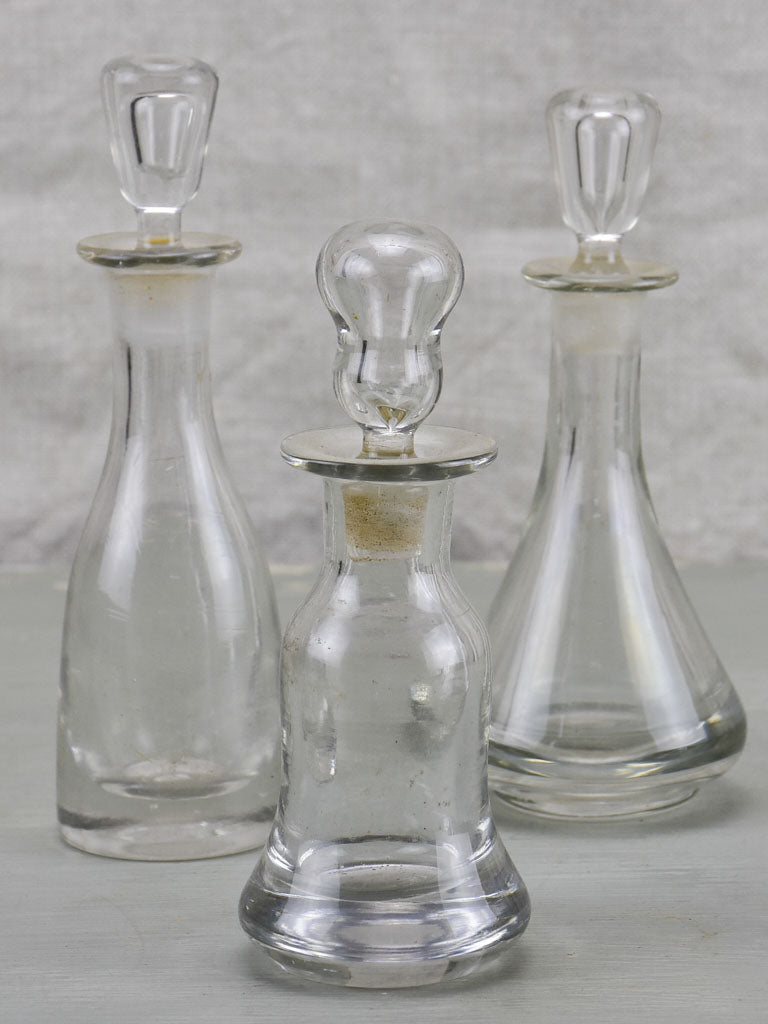 Three antique French absinthe bottles with stoppers
