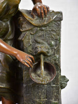 Early twentieth century metal sculpture of a lady at a fountain 30¼"