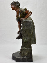 Early twentieth century metal sculpture of a lady at a fountain 30¼"