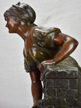 Early twentieth century metal sculpture of a lady at a fountain 30¼"