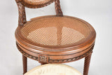 Louis XVI-style armchairs with cross-stitch upholstery