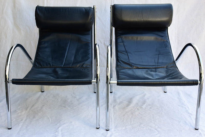 Pair of 1950's black leather and chrome armchairs in the style of Le Corbusier Charlotte Perriand