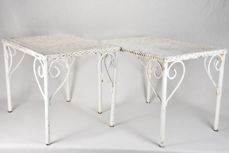 Pair of perforated wrought iron garden coffee tables