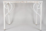 Pair of perforated wrought iron garden coffee tables