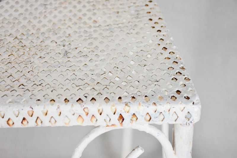 Pair of perforated wrought iron garden coffee tables
