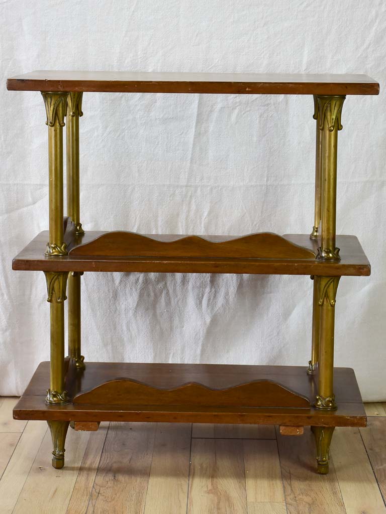 Early twentieth century shelving unit with bronze frame from a boutique 32¼"