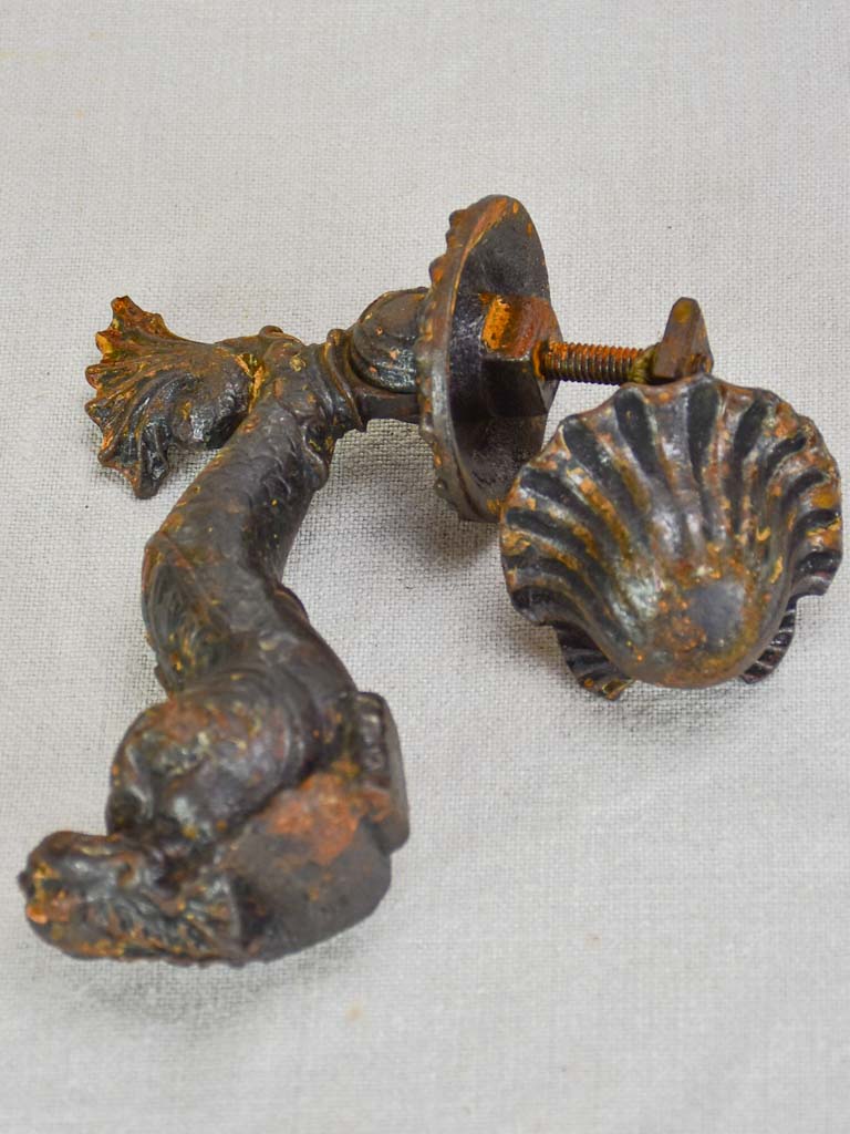 Antique cast iron door knocker dolphin and shell motif