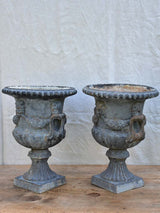 Pair of Napoleon III cast iron garden urns