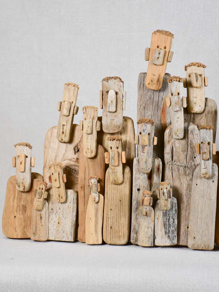 Panoramic driftwood sculpture by JP Dreano - 34 characters 27½"