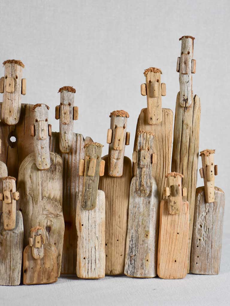 Panoramic driftwood sculpture by JP Dreano - 34 characters 27½"