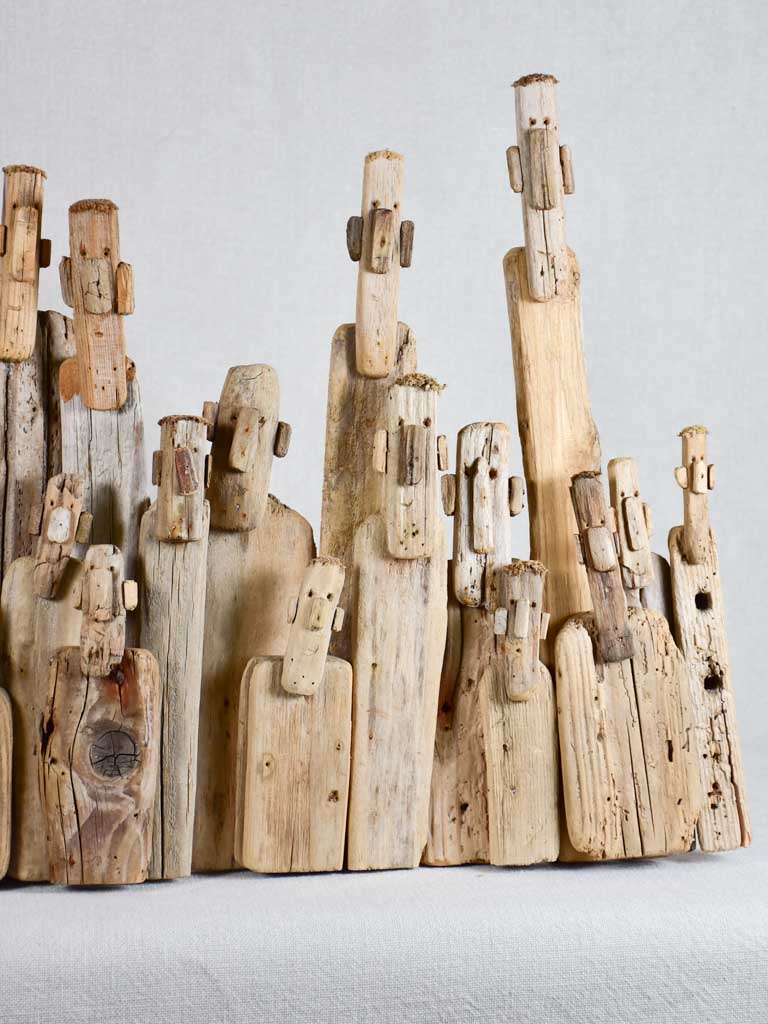 Panoramic driftwood sculpture by JP Dreano - 31 characters 28¾"