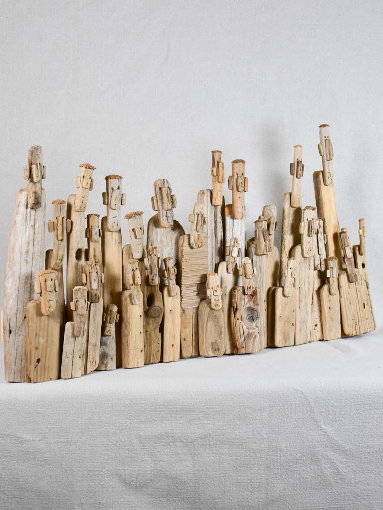 Panoramic driftwood sculpture by JP Dreano - 31 characters 28¾"