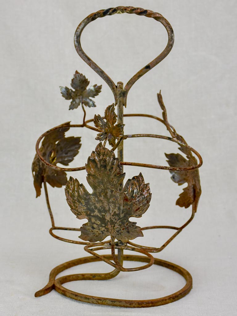 Whimsical vine-leaf decorated bottle carrier